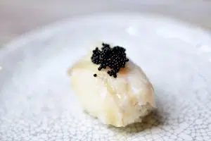 Black tobiko on nigiri sushi